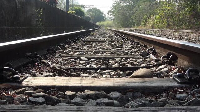 Sunlight falling on the railway tracks and sleepers.