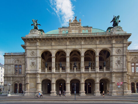 Vienna State Opera House Facade - Neo-Renaissance exterior of the famous Wiener Staatsoper in Austria on a bright summer day with people passing by.