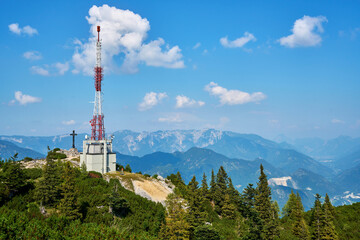 Obraz premium Telecommunication tower on the summit of Mount Katrin in the Salzkammergut region, Austria.
