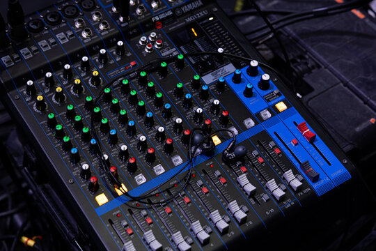 Professional In-Ear Monitors on an Audio Mixing Console in a Studio