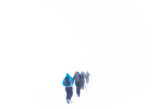 Abania Tomorr mountain hiking group inside clouds very low visibility