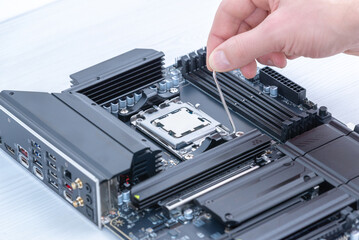 Securing cpu in motherboard socket with retention bracket, detailed computer hardware installation and pc assembly process