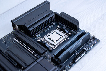 Desktop motherboard with installed processor and power delivery heatsinks, advanced pc hardware for gaming and high performance computing