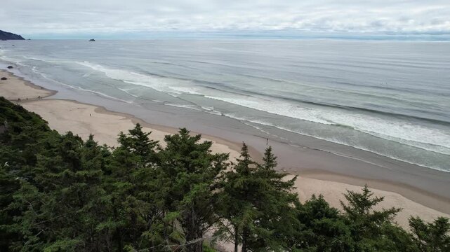 Aerial of Arcadia beach in the pacific northwest of Oregon. Turning drone shot of ocean.