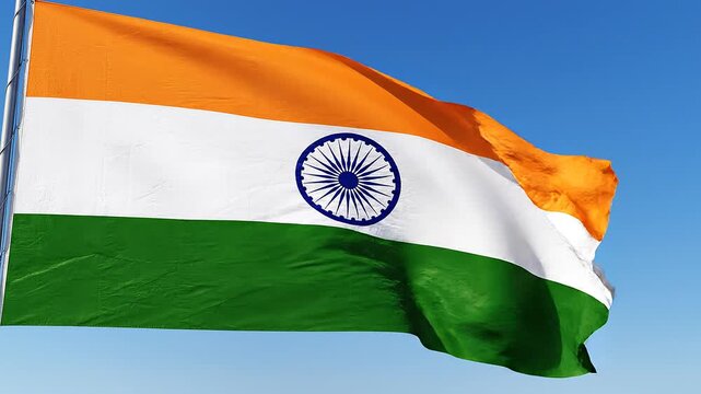 Indian flag waving in the wind on a clear day in India, symbolizing national pride and patriotism