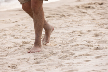 Walking on the Beach Sand in Gulf Shores Alabama During Sunset by the Shore With Gentle Waves in the Background
