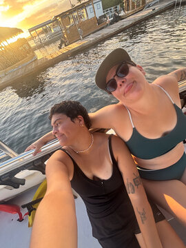 UGC queer couple selfie on a boat