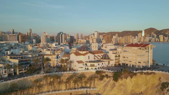 Aerial view of benidorm cityscape and old town at sunset