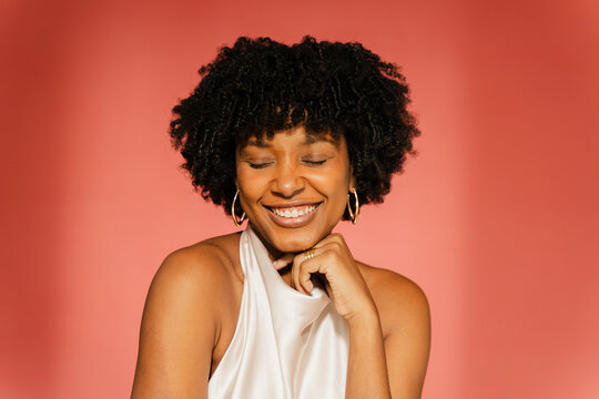 Stylish woman smiles in studio