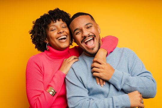 Couple laughing in studio