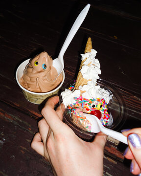 Hands Holding A Fun Ice Cream Cone