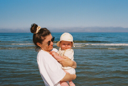Mother and her baby opposite the Baltic sea