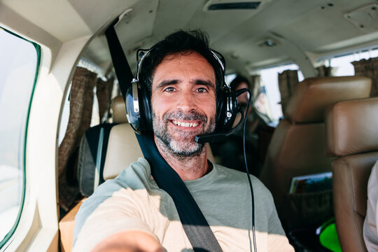 Smiling Man Selfie in Copilot Seat of a small plane