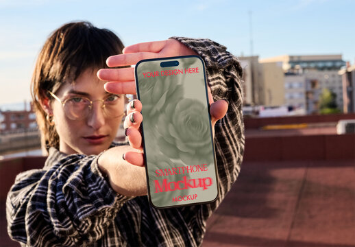 Real photo of woman showing a Smartphone. PSD mockup