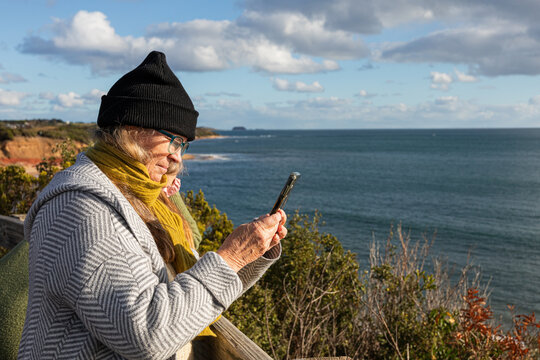 Woman Enjoying Scenic View by the Ocean in Phillip Island Victoria