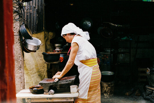 Woman Preparing Traditional Food with Passion