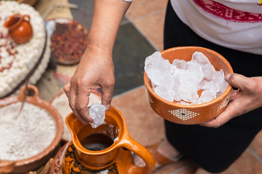 Ice chunks added to pitcher for traditional drink