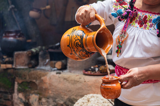 Traditional corn atole in a clay pot