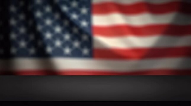 Dark empty modern counter with a softly blurred United States of America flag waving behind, ideal for showcasing items with a sense of patriotism and national pride.