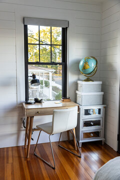 Small cozy Home office desk with globe map