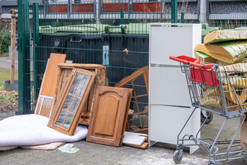 Fototapeta premium bulky waste reduction, large pile discarded furniture, renovation or decluttering process, used things on street, problem shredding garbage, debris trash, diverted for recycling, pollution nature