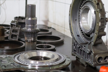 Inner view of a heavy-duty Allison transmission retarder housing showing the intricate stator vanes and hydraulic channels on a workshop table for professional maintenance and repair.