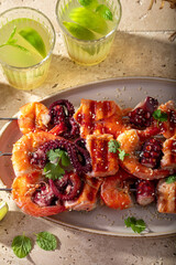 Spicy roasted skewer with shrimps and octopus.