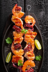 Spicy roasted skewer as summer delicacy in garden.