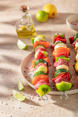 Preparations for grilling delicious skewers with vegetables and red beef