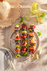 Tasty grilled skewer as summer delicacy in sunny day.