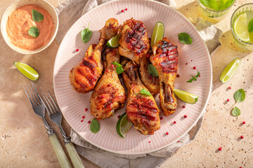 Spicy roasted chicken leg with spices and herbs.