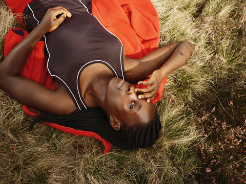 Black Woman Hiking in Red Fleece in Autumn Field