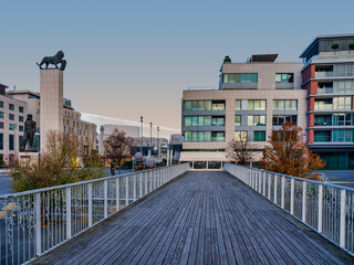 Wooden Riverside Bridge And Eurovea Modern Buildings At Sunrise
