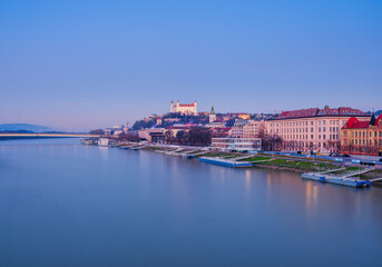 Fototapeta premium Bratislava Castle and Historic Riverside Buildings on Danube River