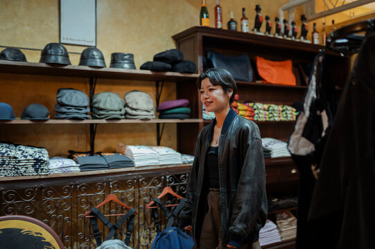 Woman shopping for clothes in retail store