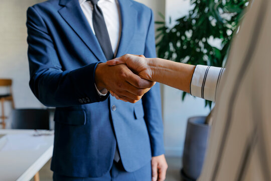 Business people shaking hands making deal agreement