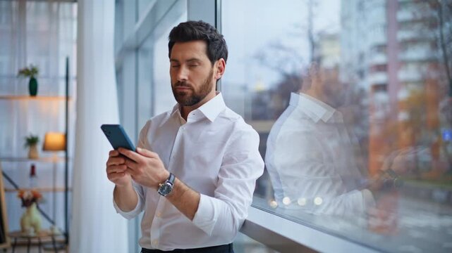 Elegant leader typing smartphone sending email office panoramic window closeup