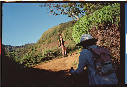 Woman hiking the Waihee Ridge Trail in Maui 