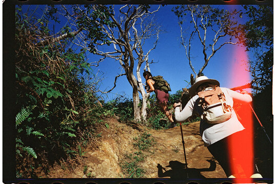 Woman hiking the Waihee Ridge Trail in Maui 