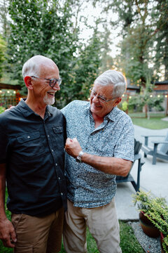 Candid moment between two friends outdoors, shared laughter