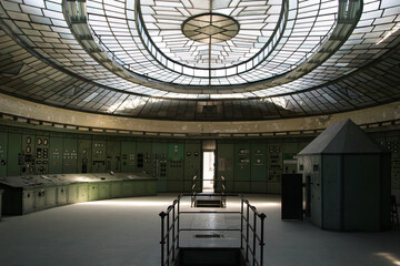 Circular industrial hall with glass dome ceiling and control panels © monika.kurucz