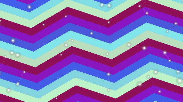 Vibrant chevron pattern with layered stripes and scattered dots in a dynamic graphic design