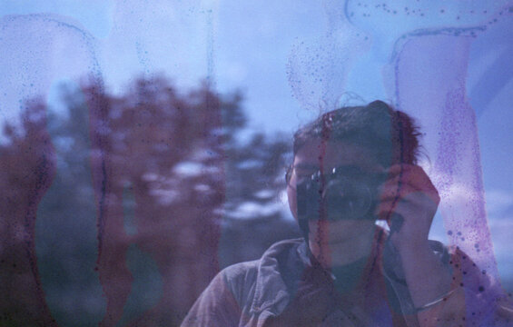 Self portrait in the window of the car