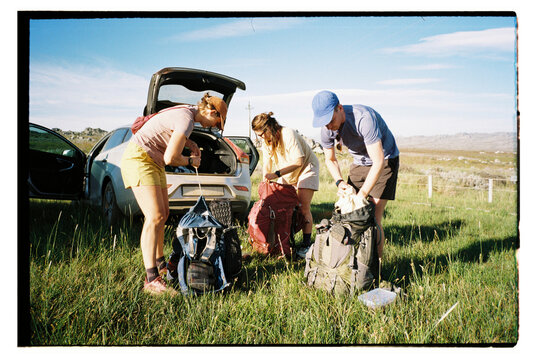 friends Prepare for Hiking Adventure