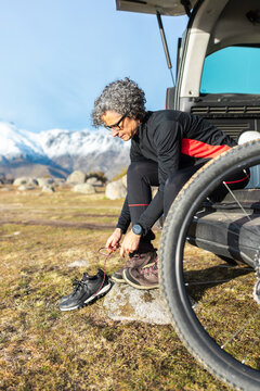 Woman preparing for mountain biking adventure