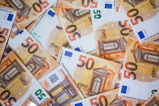 Euro banknotes scattered background of 50 euro bills