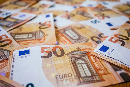 Euro currency notes scattered in a pile