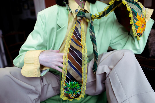 woman in green suit and tie