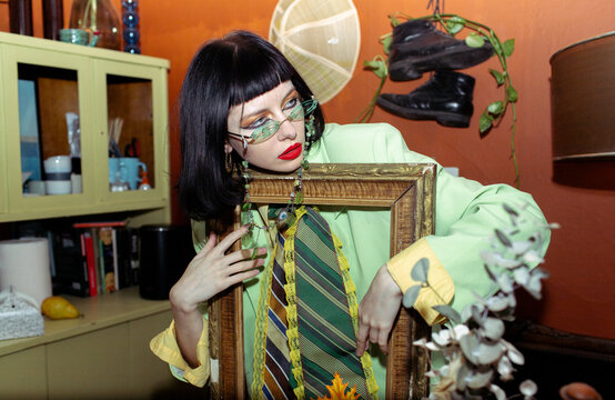 woman in green suit and tie