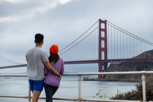 Asian Couple hug selective focus  Golden Gate Bridge  